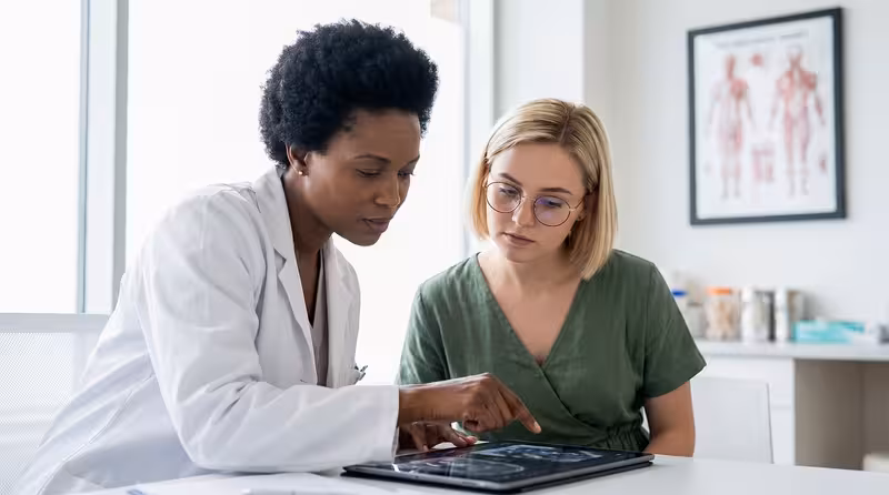 Disabled Access: A doctor and patient during a consultation Doctor and patient consultation for Disabled Access - Cambridge: Private Microsuction Ear Wax Removal In Cambridge CB2 Real...