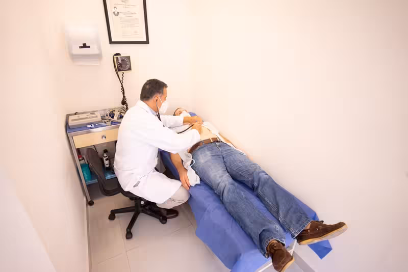 Doctor in clinic for Find Out More - Patient Charter At Ashford: Private Microsuction Ear Wax Removal In Ashford TN24